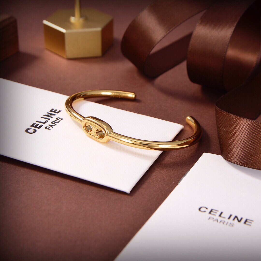 Celine Maillon Triomphe Thin Cuff In Brass With Gold Finish - everydesigner