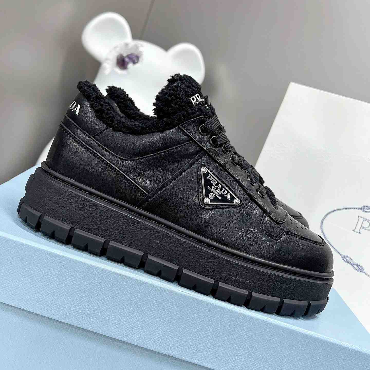 Prada Leather And Shearling Sneakers - everydesigner