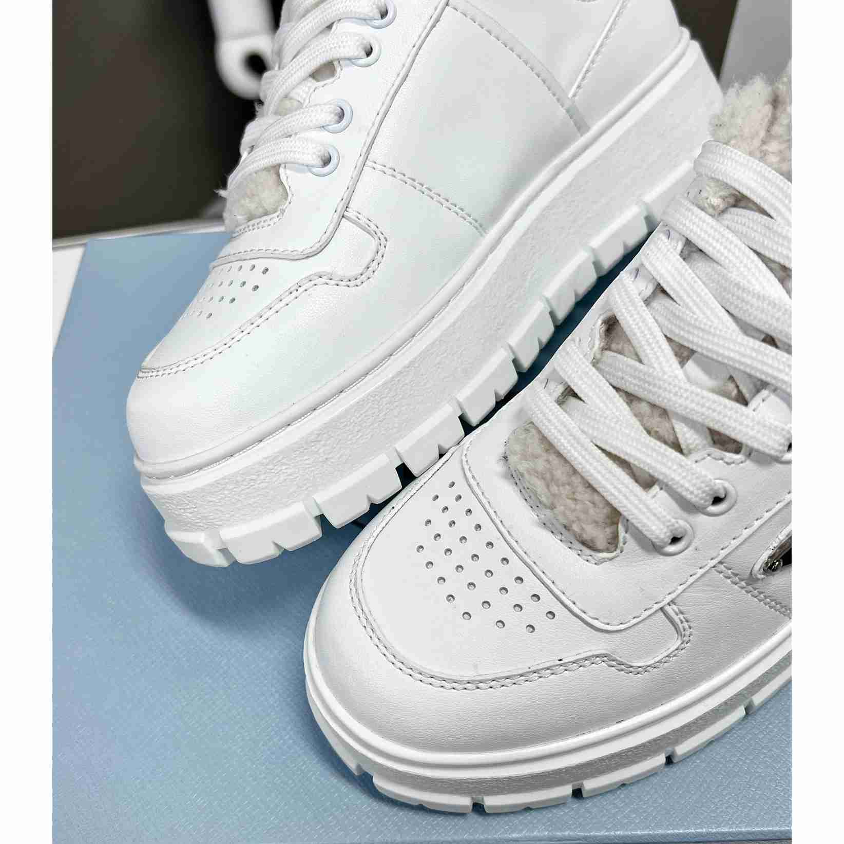 Prada Leather And Shearling Sneakers - everydesigner