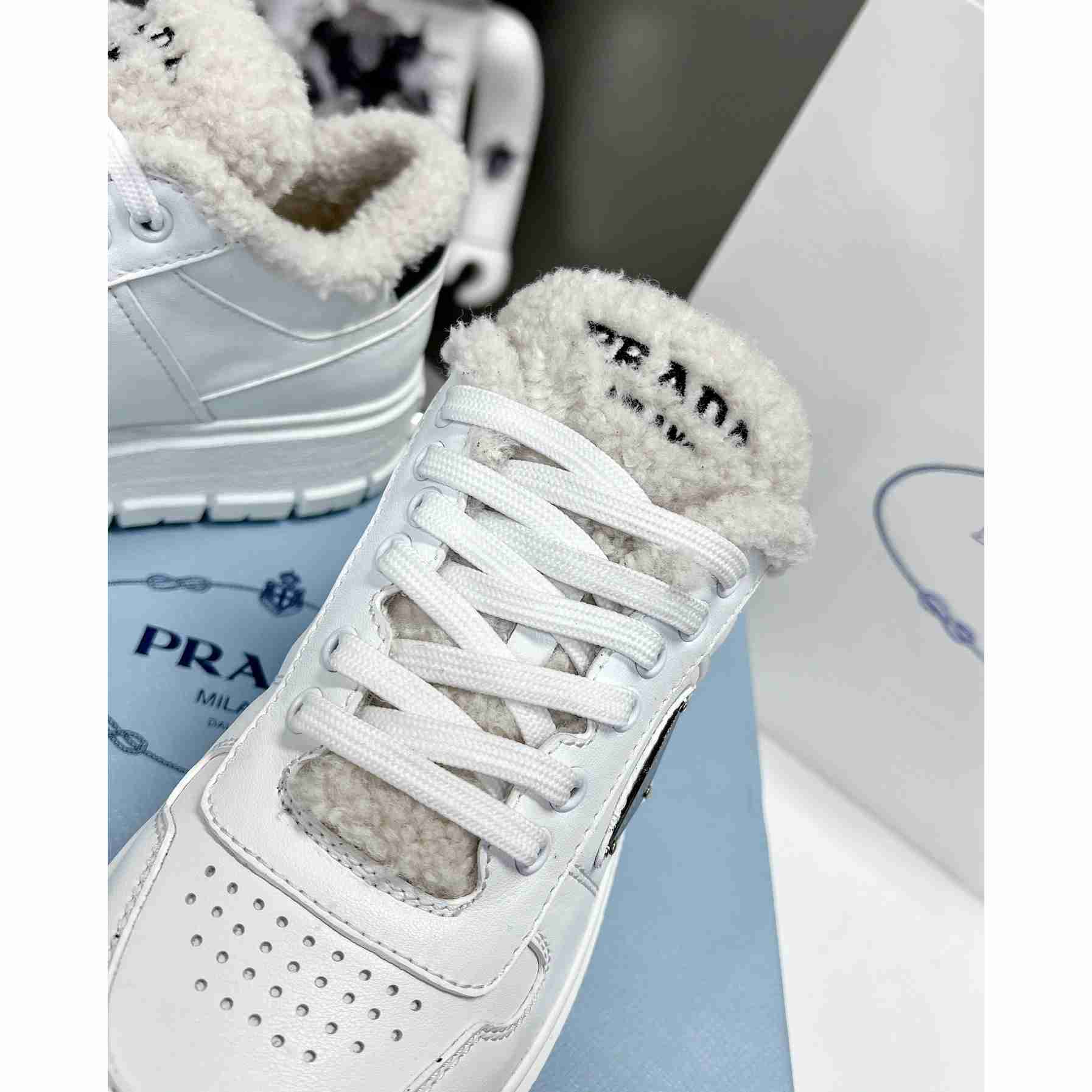 Prada Leather And Shearling Sneakers - everydesigner