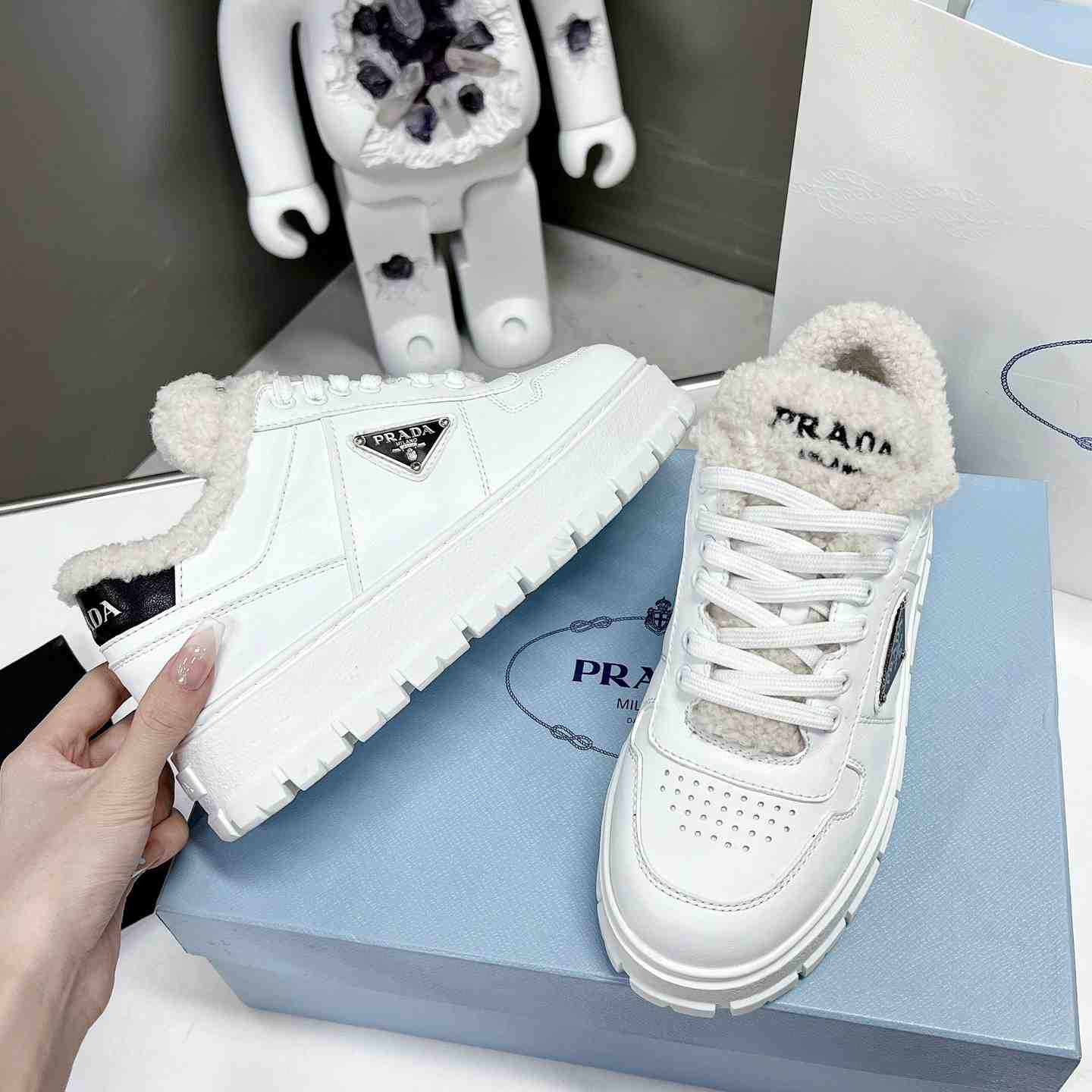 Prada Leather And Shearling Sneakers - everydesigner