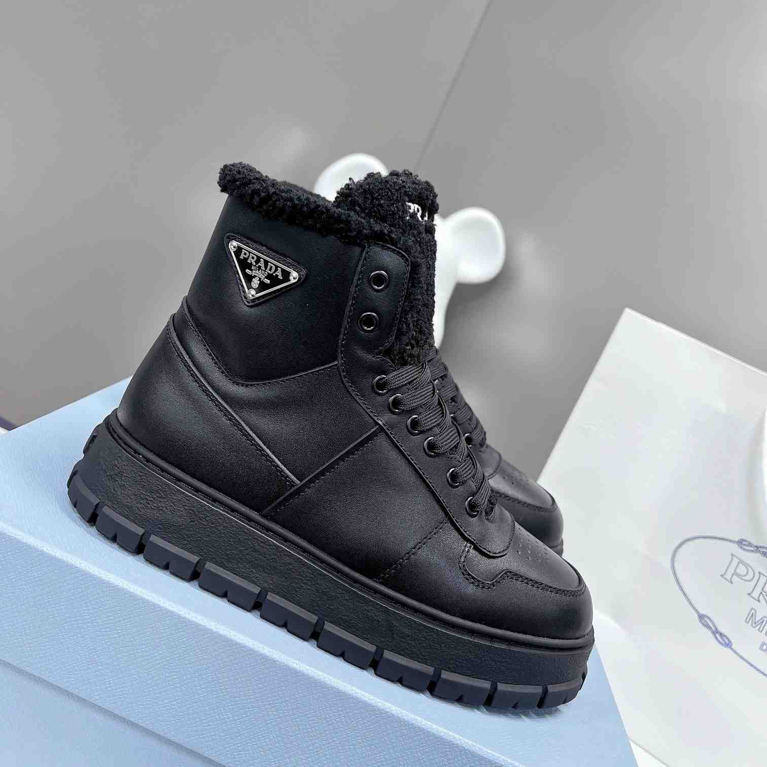 Prada Leather And Shearling High-top Sneakers - everydesigner