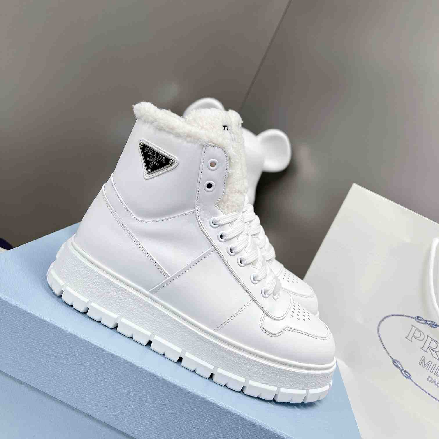 Prada Leather And Shearling High-top Sneakers - everydesigner